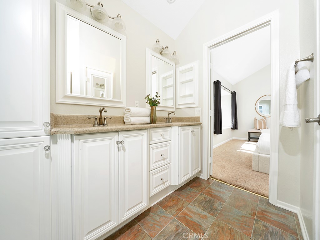 25102 Danabirch Dana Point, CA 92629 - Photo 15 of 53 a bathroom with a double vanity sink mirror and
