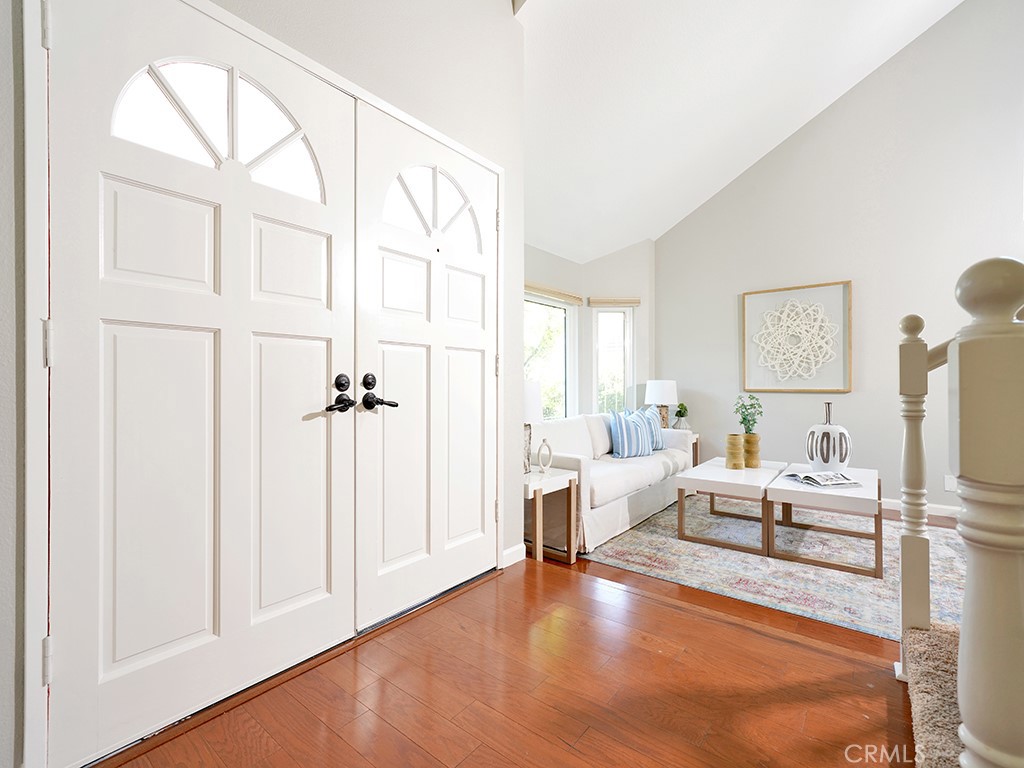 25102 Danabirch Dana Point, CA 92629 - Photo 25 of 53 a living room with furniture a large window and a wooden floor