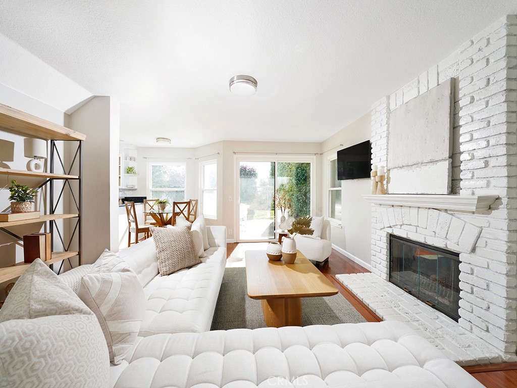 25102 Danabirch Dana Point, CA 92629 - Photo 26 of 53 a living room with furniture fireplace and a flat screen tv