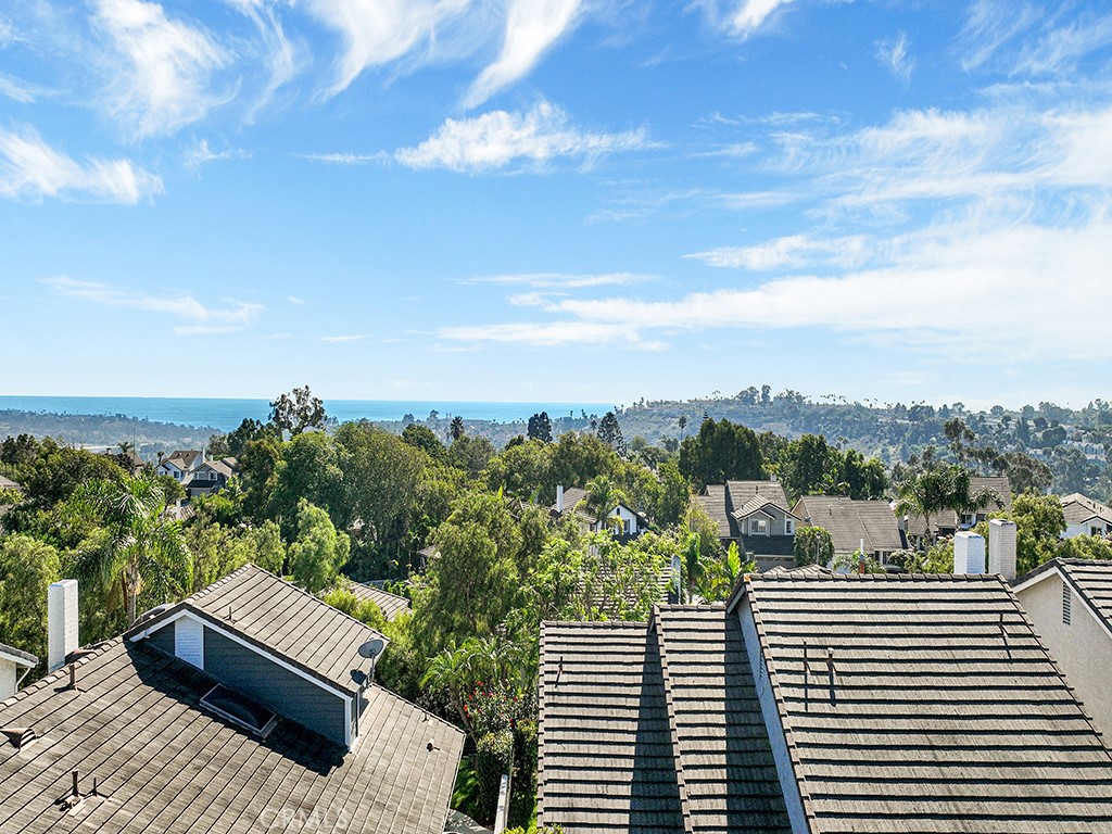 25102 Danabirch Dana Point, CA 92629 - Photo 33 of 53 a view of a balcony with wooden floor and a bench