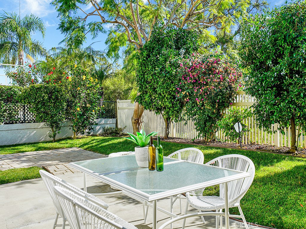 25102 Danabirch Dana Point, CA 92629 - Photo 38 of 53 a table and chairs in a garden