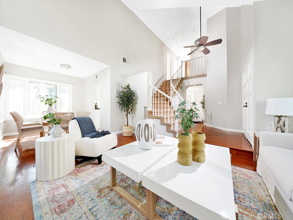25102 Danabirch Dana Point, CA 92629 - Photo 4 of 53 a living room with furniture a chandelier and a table