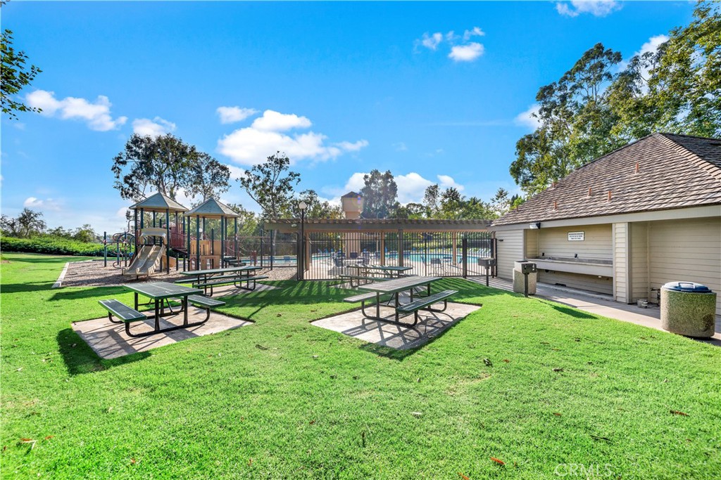25102 Danabirch Dana Point, CA 92629 - Photo 46 of 53 a view of a backyard with couches plants and wooden fence