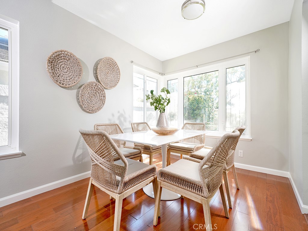 25102 Danabirch Dana Point, CA 92629 - Photo 5 of 53 a view of a dining room with furniture window and wooden floor