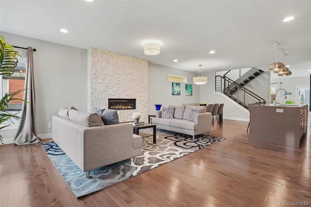 a living room with furniture and a fireplace