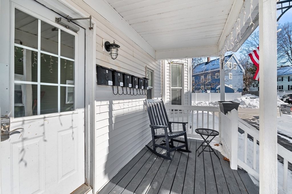 5-7 Vernon Street, Unit 1 Haverhill, MA 01835 - Photo 20 of 22 a view of a chairs and a table in the balcony