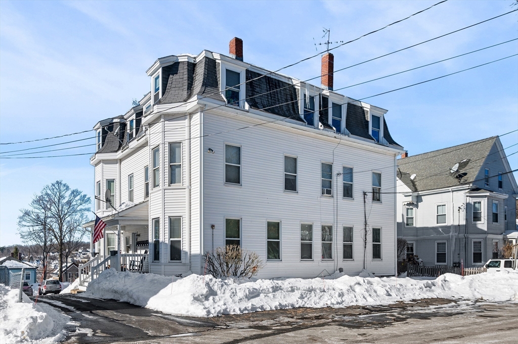 5-7 Vernon Street, Unit 1 Haverhill, MA 01835 - Photo 22 of 22 a front view of a building with a street