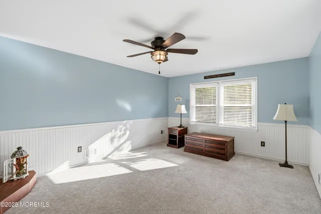 a bedroom with furniture and windows