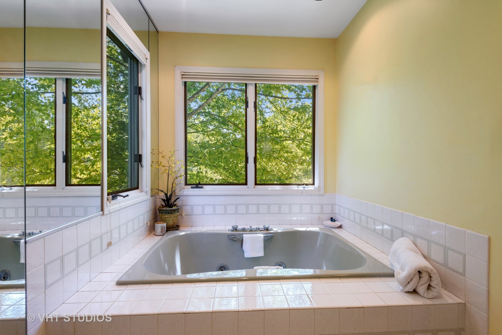 811 Becker Road Glenview, IL 60025 - Photo 13 of 33 a bath tub sitting in a bathroom next to a window