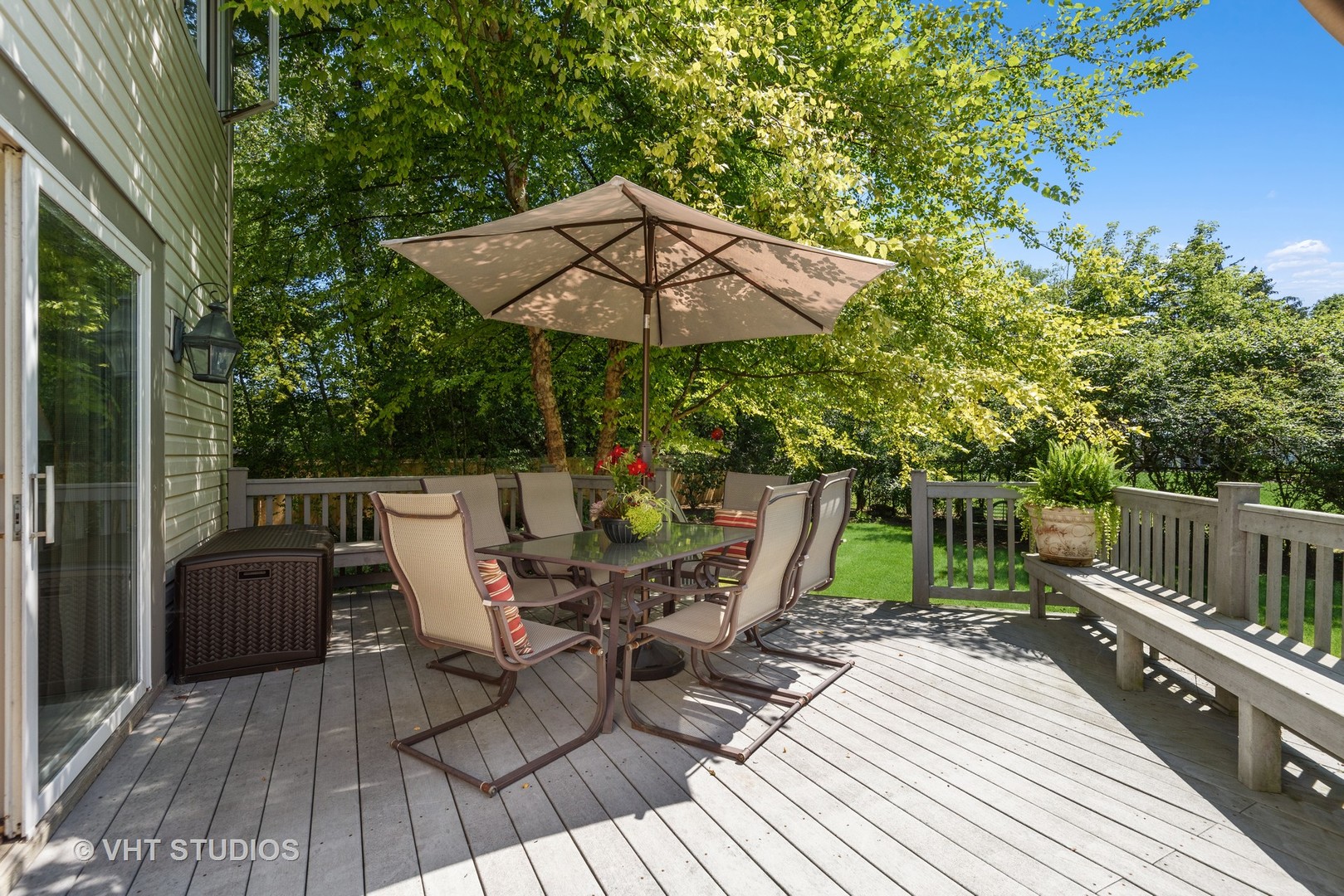 811 Becker Road Glenview, IL 60025 - Photo 24 of 33 a view of deck with table and chairs under an umbrella with wooden floor