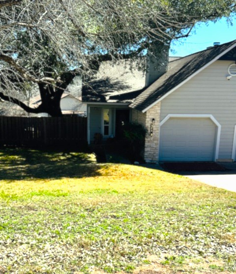 371 Fantail Loop, Unit B Austin, TX 78734 - Photo 1 of 10 View of front of home featuring a chimney, driveway, and a garage
