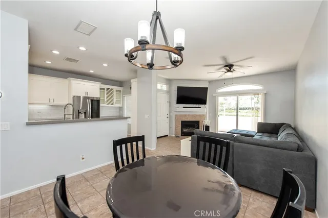 a view of a dining room with furniture wooden floor and chandelier