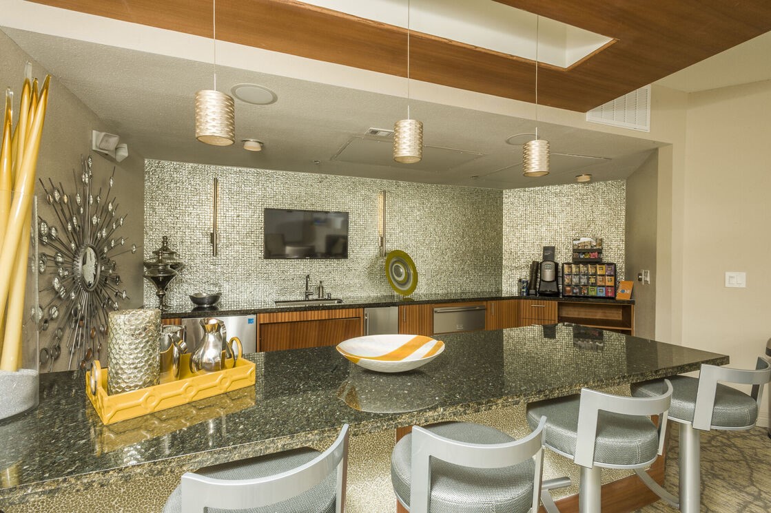 5800 Woodway Drive, Unit 228 Houston, TX 77057 - Photo 15 of 23 a kitchen with a dining table and chairs