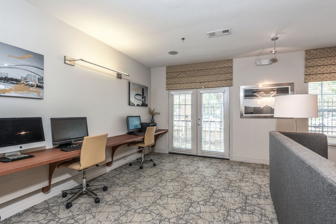 5800 Woodway Drive, Unit 228 Houston, TX 77057 - Photo 10 of 23 a living room with furniture and a flat screen tv