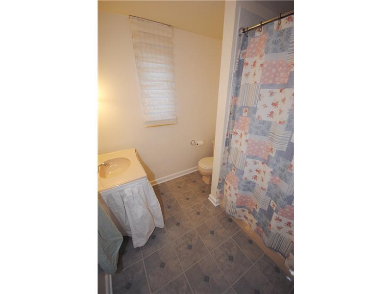 3304 Comanche Road Upper St. Clair, PA 15241 - Photo 10 of 20 Full Bath. Full Bath on first floor has yellow fixtures, bathtub & shower.