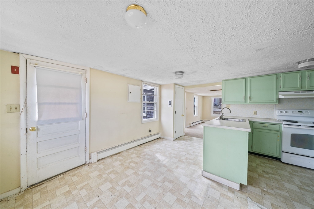 3 Short Neck Road Wareham, MA 02532 - Photo 5 of 24 a room with a stove and a refrigerator