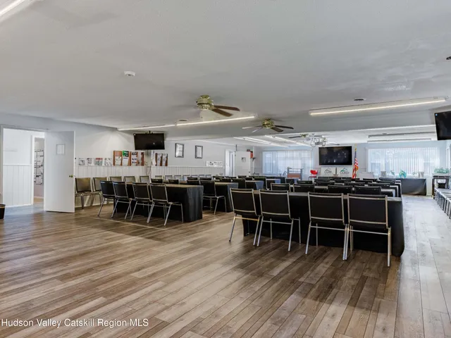 a room with lots of furniture and kitchen