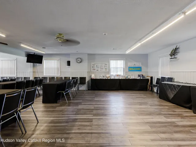 a view of kitchen and dining room with wooden floor