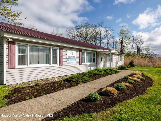 a house with garden in front of it