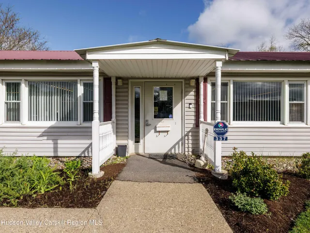 a front view of a house with a porch