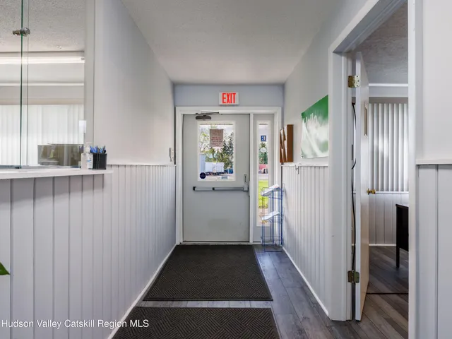 a view of hallway with wooden floor