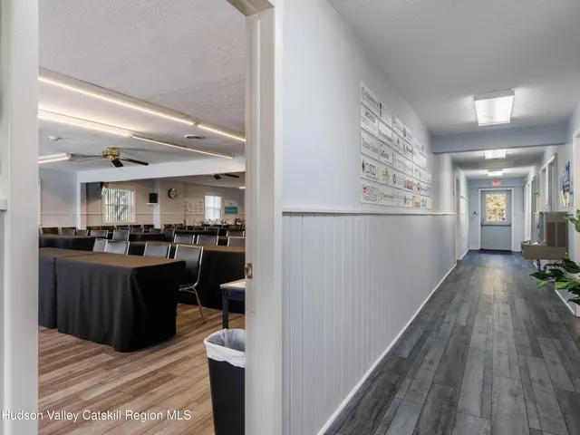 a kitchen with a refrigerator and a counter top space