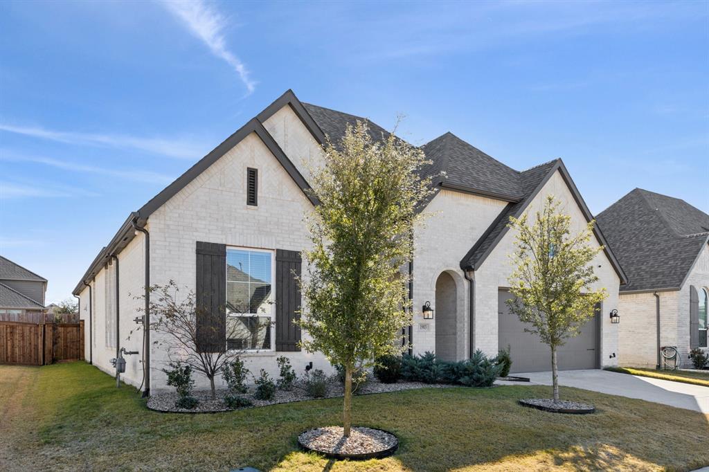 1903 Midhurst Drive Forney, TX 75126 - Photo 26 of 31 a front view of a house with a yard