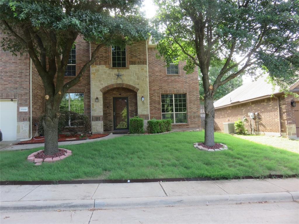 1122 Walter Stephenson Road Midlothian, TX 76065 - Photo 1 of 26 Brick and stone facade featuring an arched entryway with a glass-paneled door