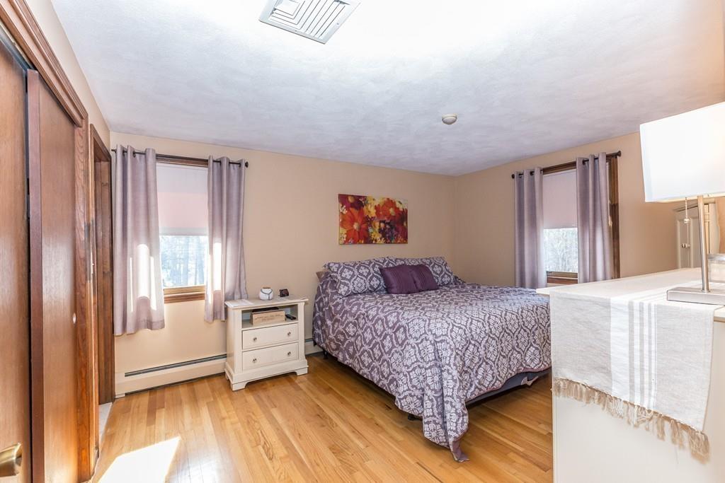 21 Meadowvale Road Burlington, MA 01803 - Photo 12 of 30 a bedroom with a bed and a large window