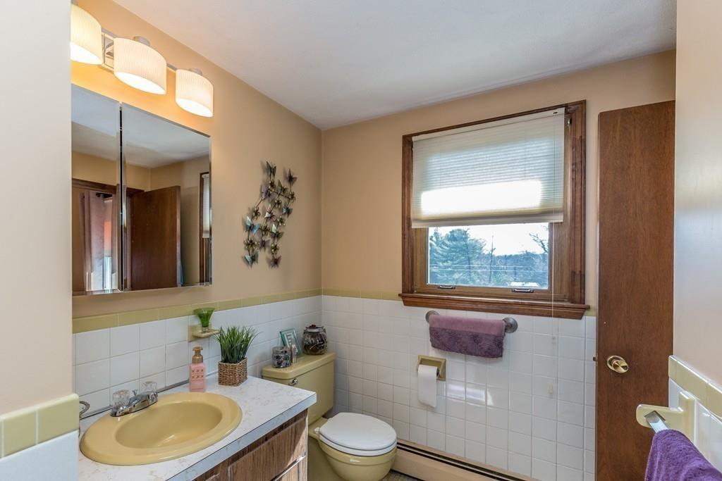 21 Meadowvale Road Burlington, MA 01803 - Photo 18 of 30 a bathroom with a toilet a sink and mirror