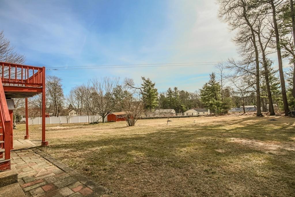 21 Meadowvale Road Burlington, MA 01803 - Photo 2 of 30 a view of a field with trees in the background
