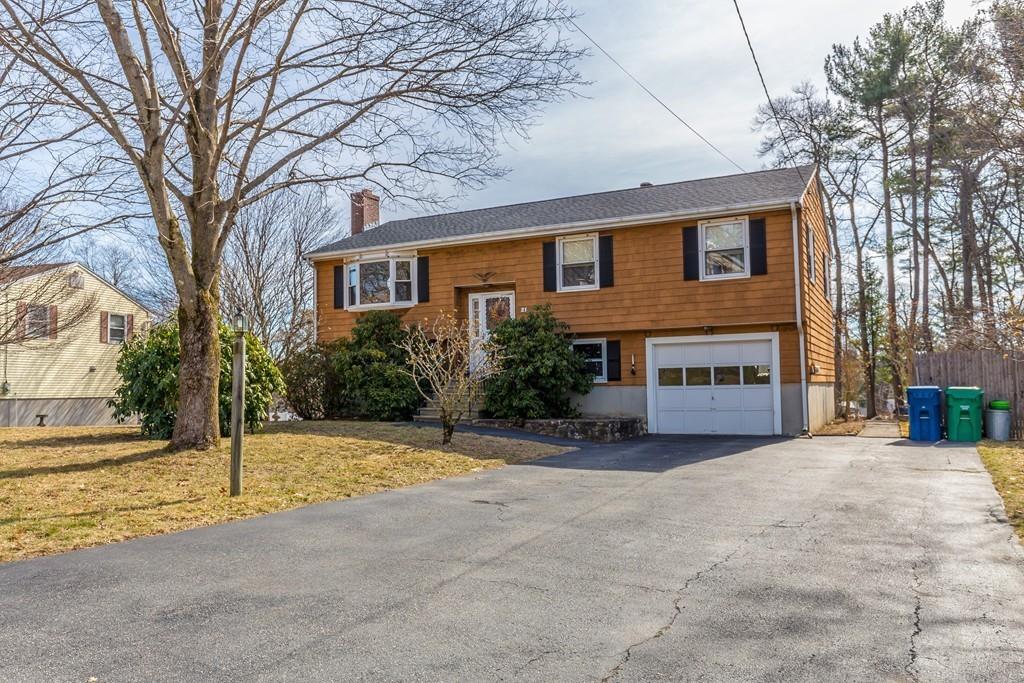 21 Meadowvale Road Burlington, MA 01803 - Photo 30 of 30 a front view of a house with a yard and garage