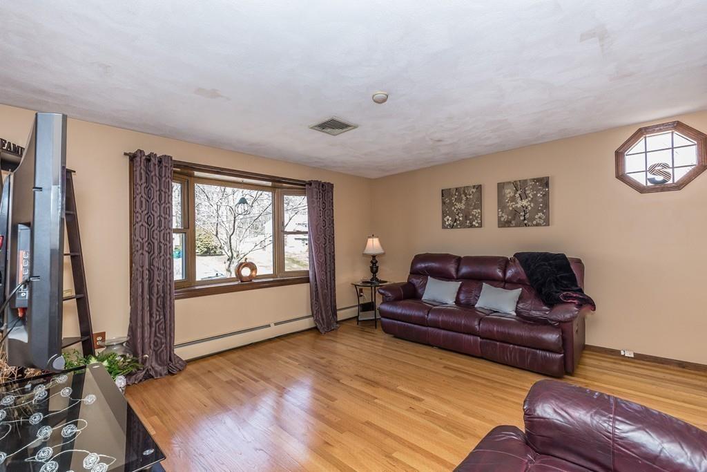 21 Meadowvale Road Burlington, MA 01803 - Photo 4 of 30 a living room with furniture and a window