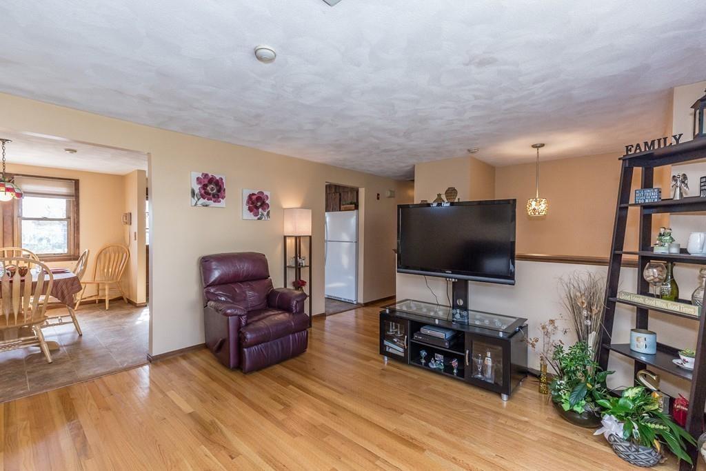 21 Meadowvale Road Burlington, MA 01803 - Photo 6 of 30 a living room with furniture and a flat screen tv