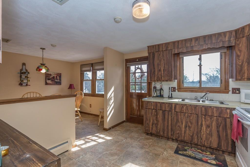 21 Meadowvale Road Burlington, MA 01803 - Photo 10 of 30 a living room with a sink furniture and a window