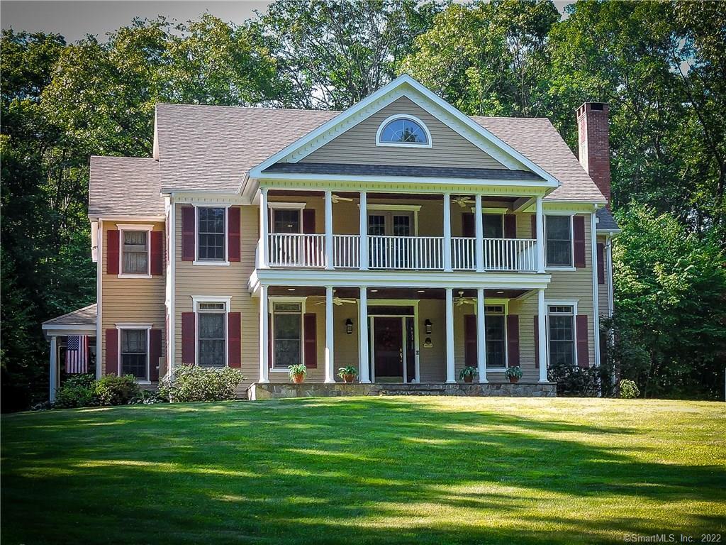 125 Castle Hill Road Newtown, CT 06470 - Photo 1 of 1 a front view of a house with a garden