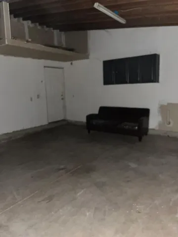 a kitchen with a sink a window and cabinets