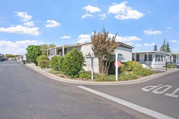 a view of a house with a street