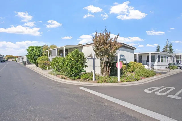 a view of a house with a street
