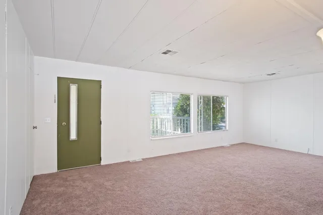 an empty room with windows