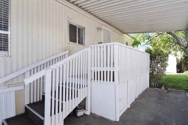 a garden with trees in front of it