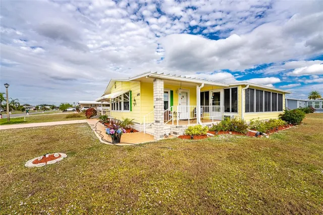 a view of a house with outdoor seating