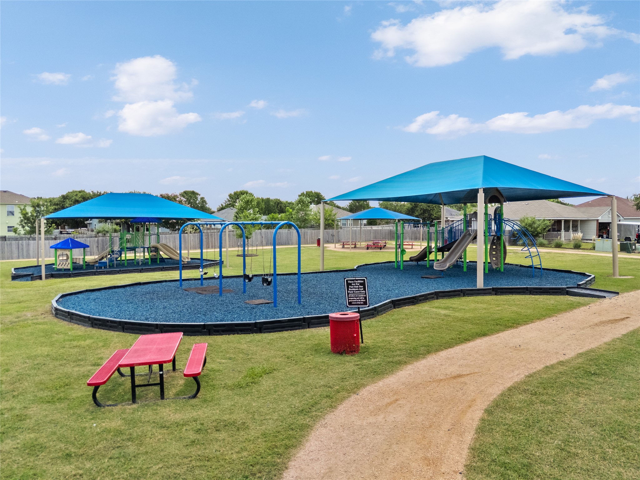256 Alpha Kyle, TX 78640 - Photo 26 of 27 A vibrant community playground provides ample space for recreation and gathering.