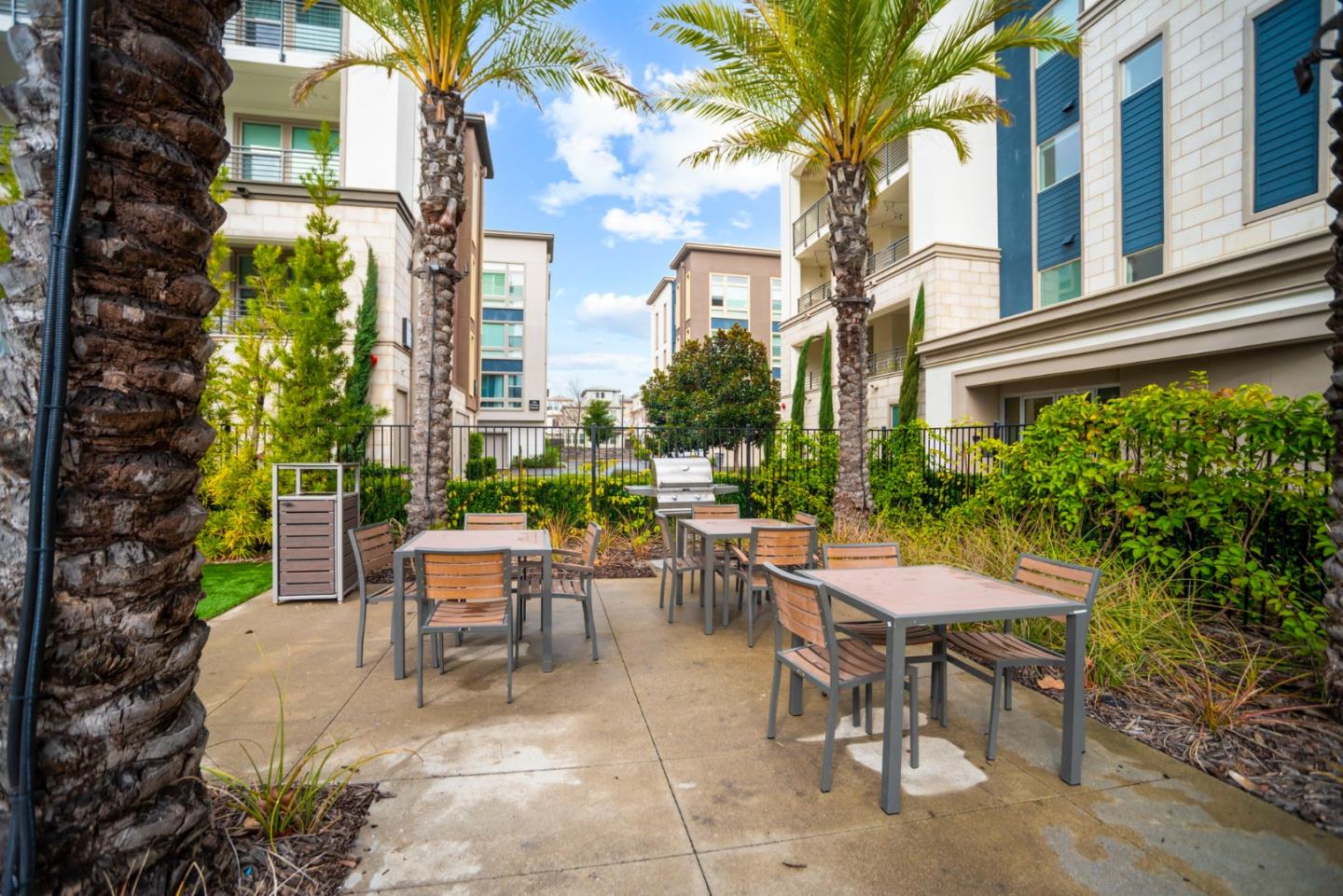 5720 Greige Circle, Unit G Dublin, CA 94568 - Photo 50 of 55 a view of a patio with a table and chairs and potted plants