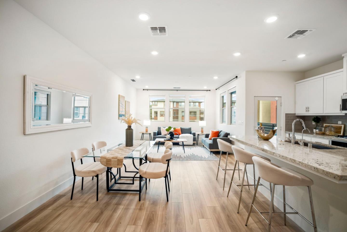 5720 Greige Circle, Unit G Dublin, CA 94568 - Photo 9 of 55 a view of a dining room with furniture a rug and wooden floor