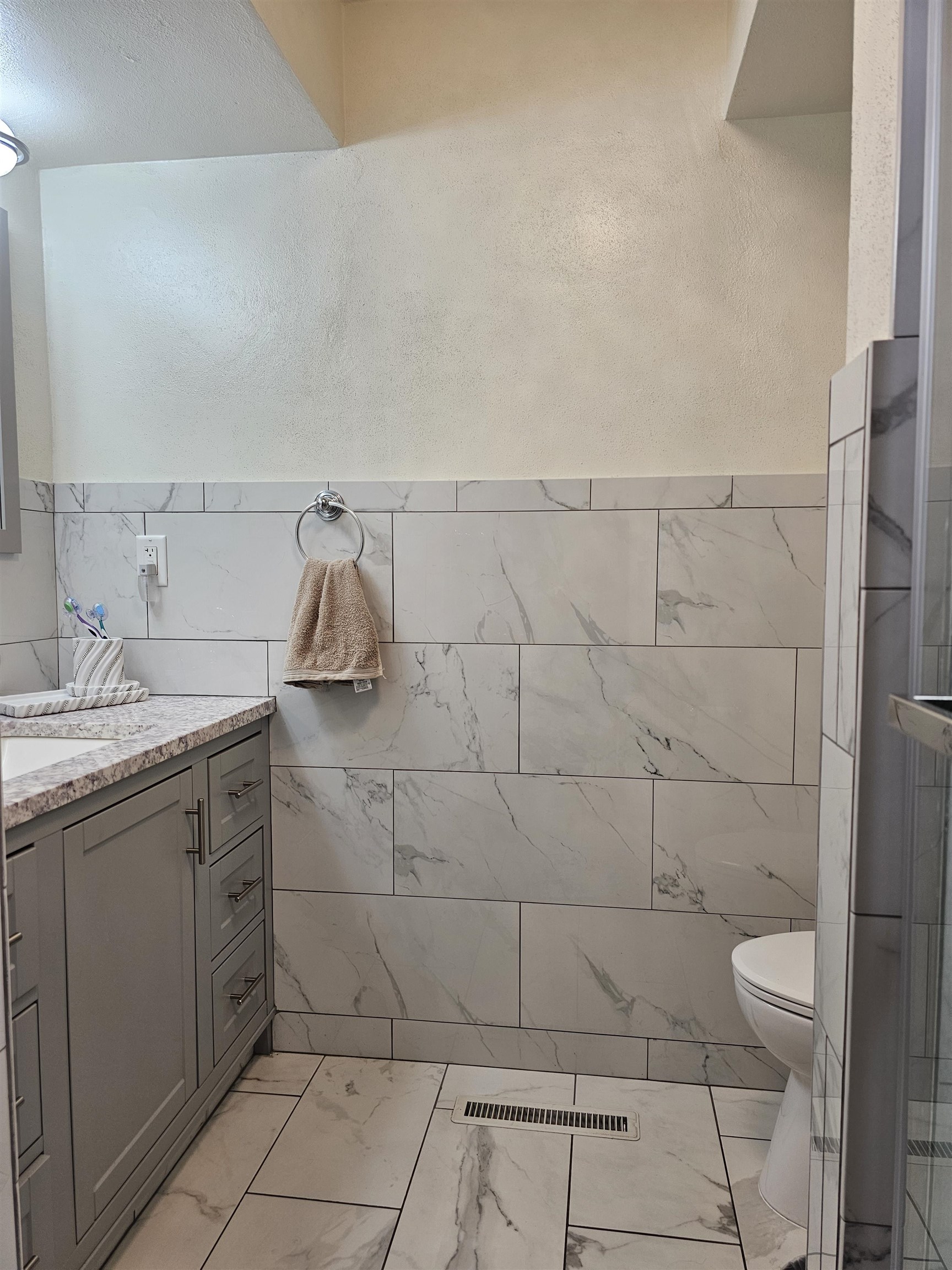 1404 Post Drive Rockford, IL 61108 - Photo 18 of 30 a bathroom with a granite countertop sink a toilet and a mirror