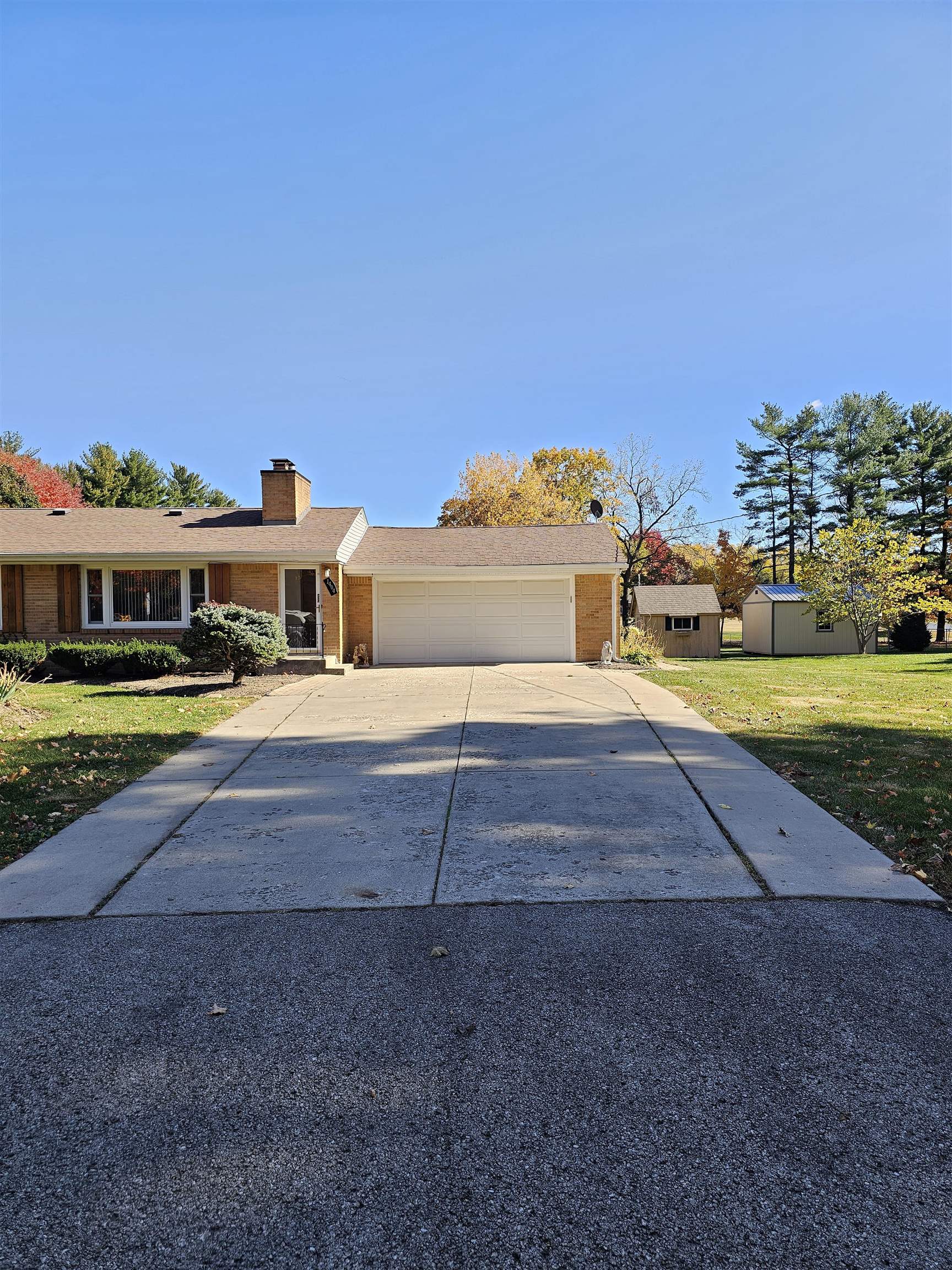 1404 Post Drive Rockford, IL 61108 - Photo 4 of 30 a view of swimming pool with outdoor seating and covered with trees