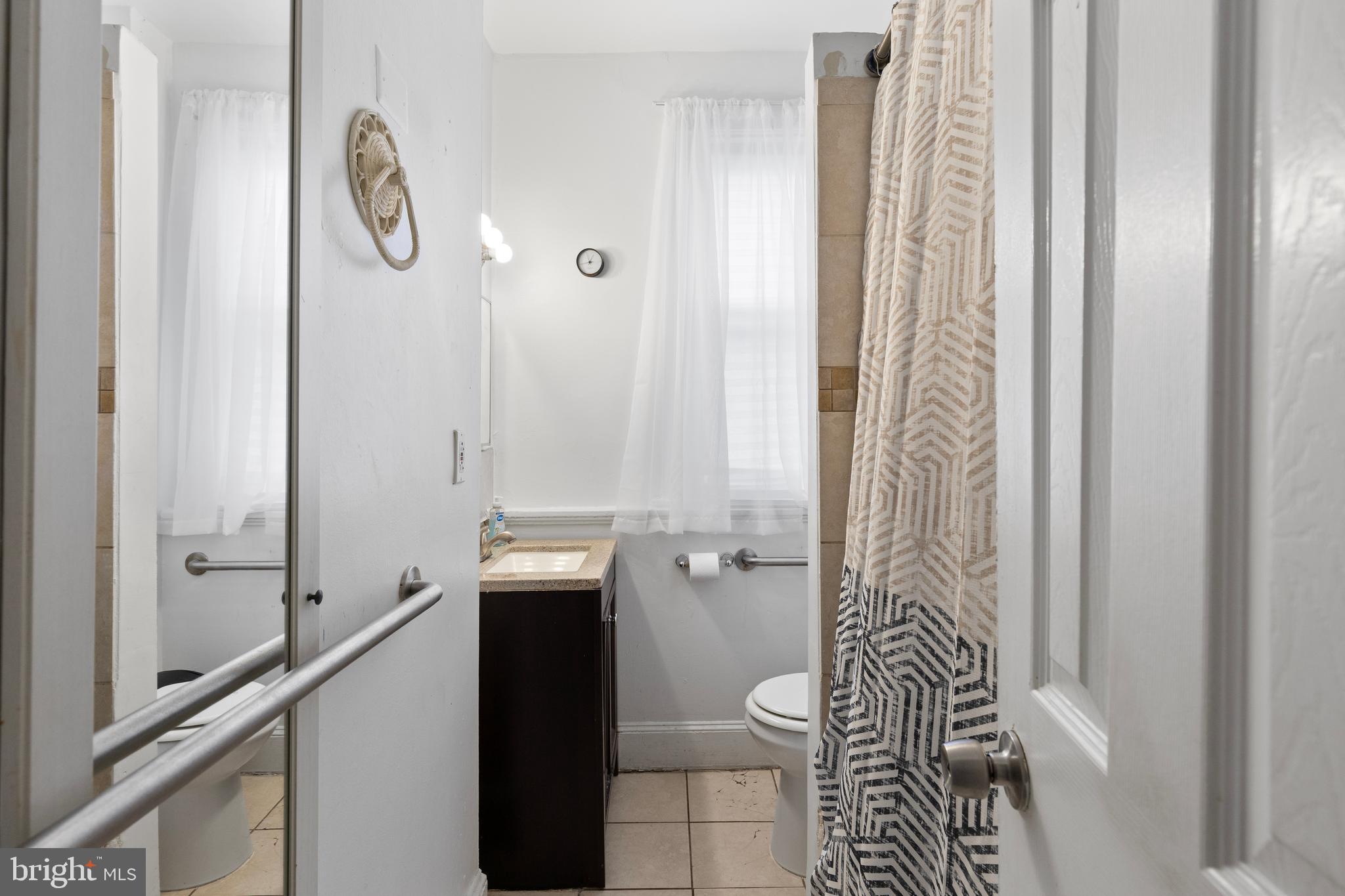 619 Columbia Road Northwest Washington, DC 20001 - Photo 16 of 29 a bathroom with a shower and a toilet