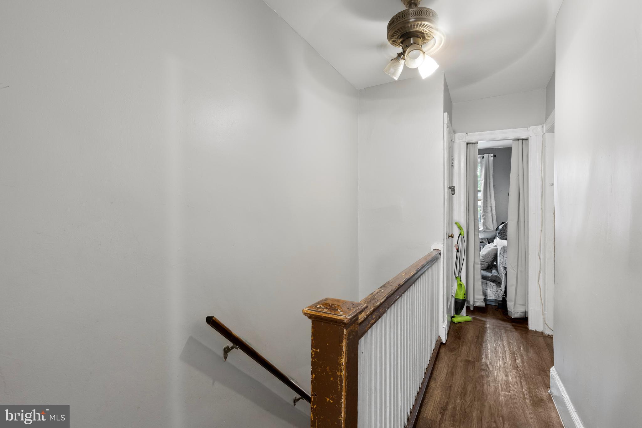 619 Columbia Road Northwest Washington, DC 20001 - Photo 18 of 29 a view of a hallway with wooden floor and staircase