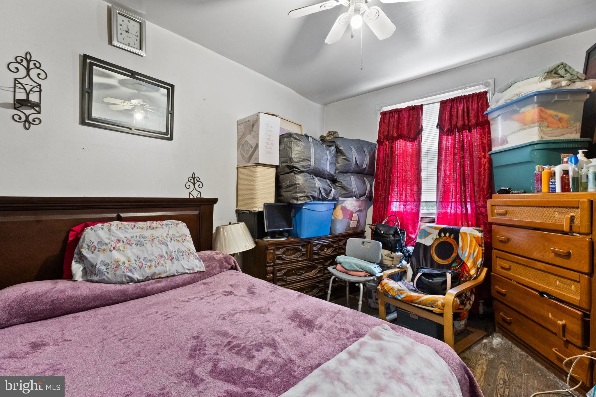 619 Columbia Road Northwest Washington, DC 20001 - Photo 20 of 29 a bedroom with furniture and a bed